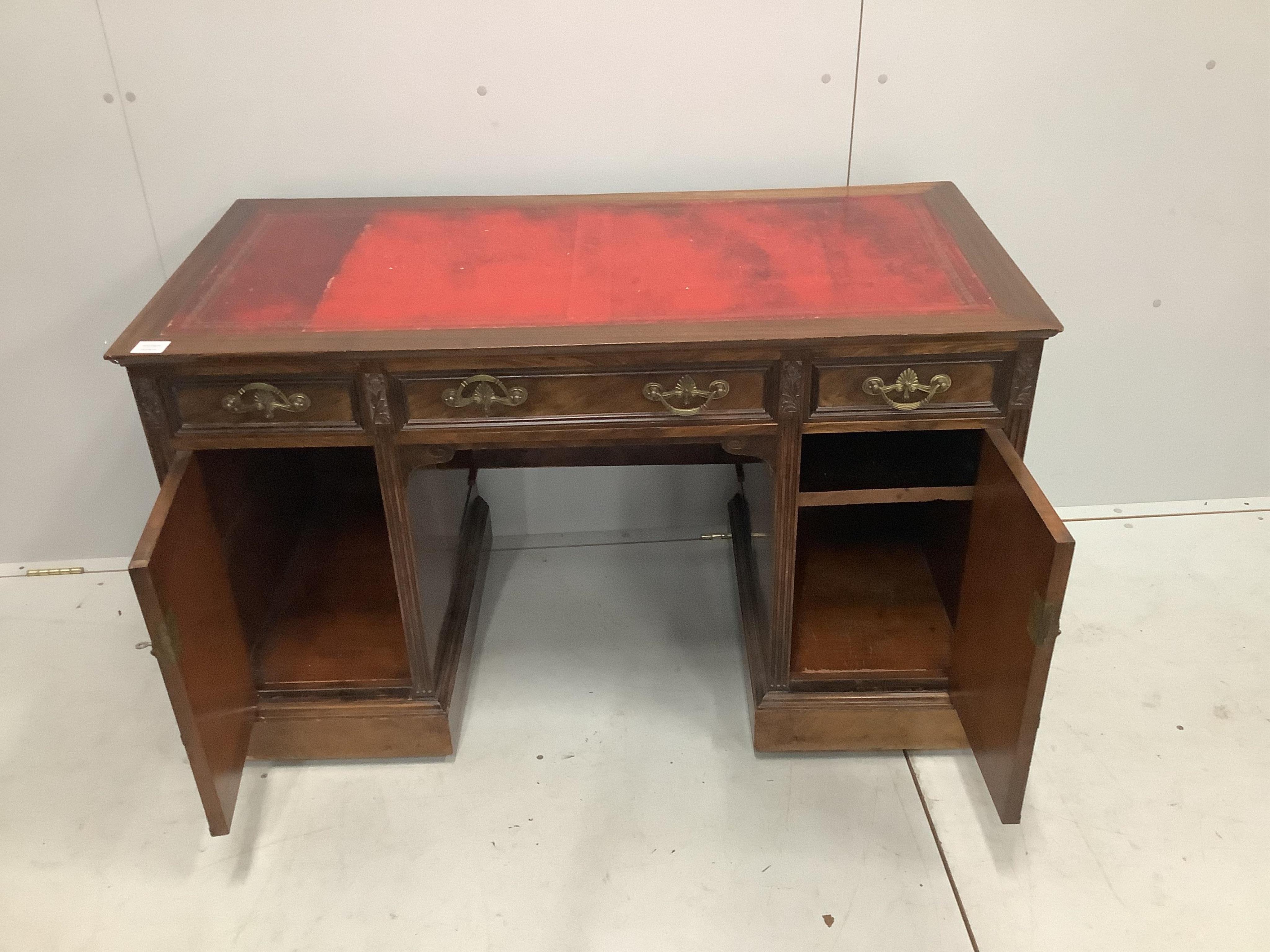 A late Victorian mahogany kneehole desk, width 120cm, depth 59cm, height 74cm. Condition - fair